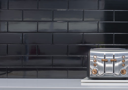 Black subway tile kitchen splashback